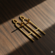 Novelika Golden Metal Tilok Kathi & Tilak Mold Set (U Shape) - Religious Tilak Stamp - Pack Of 2